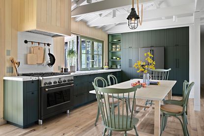 a california kitchen with dark cabinets and light floors