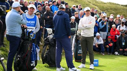 Rory McIlroy and Shane Lowry wait at the tee box at the Irish Open