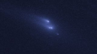 This photo from the Hubble Space Telescope shows the rare sight of the asteroid P/2013 R3 breaking apart. This image, the second in a series, was taken on Nov. 15, 2013. Image released March 6, 2014.