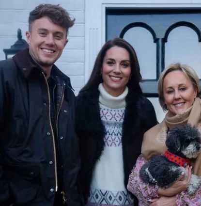 Kate Middleton posing with Martin and Roman Kemp and their family outside their house