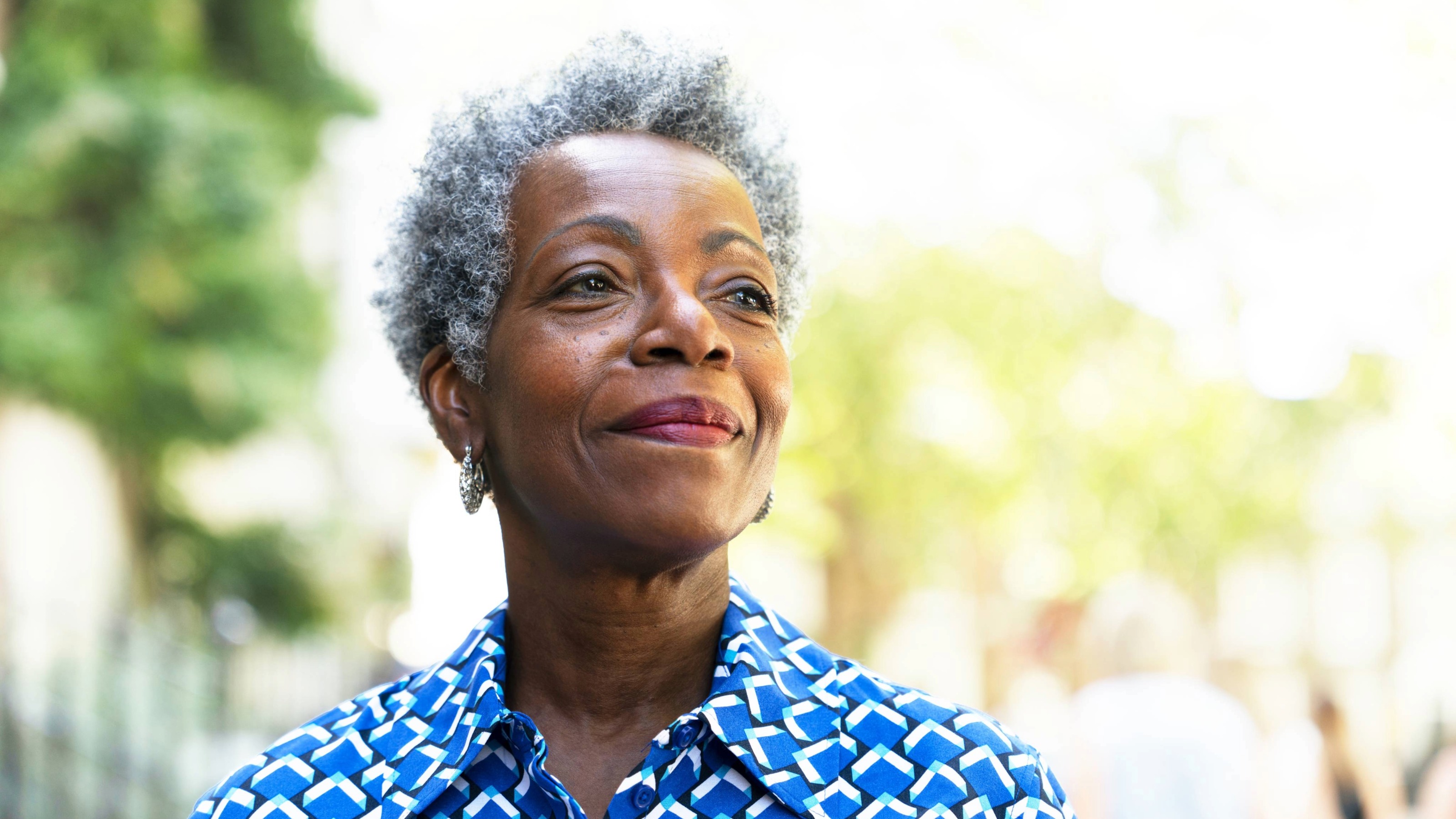 Older woman looking away and smiling