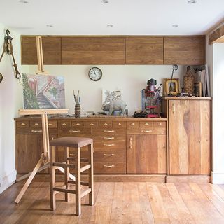 craft room with wooden cabinet and wooden flooring