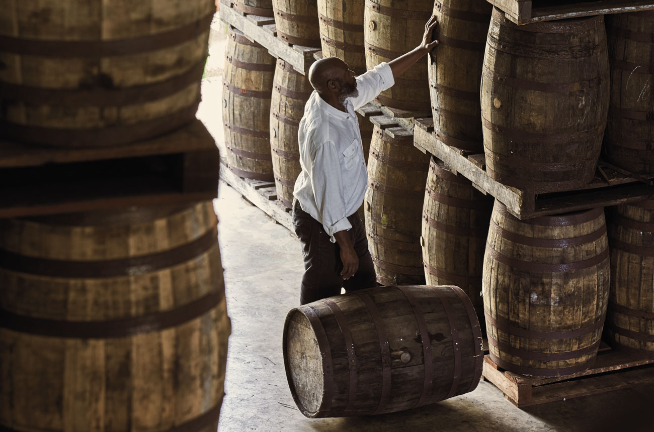Checking rum barrels at Mount Gay Distillery Barbados