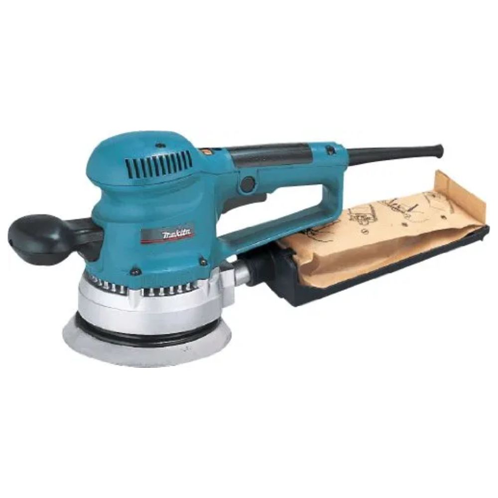 A teal and black Makita corded random orbital sander with a circular sanding pad, side handle and attached paper dust collection bag.