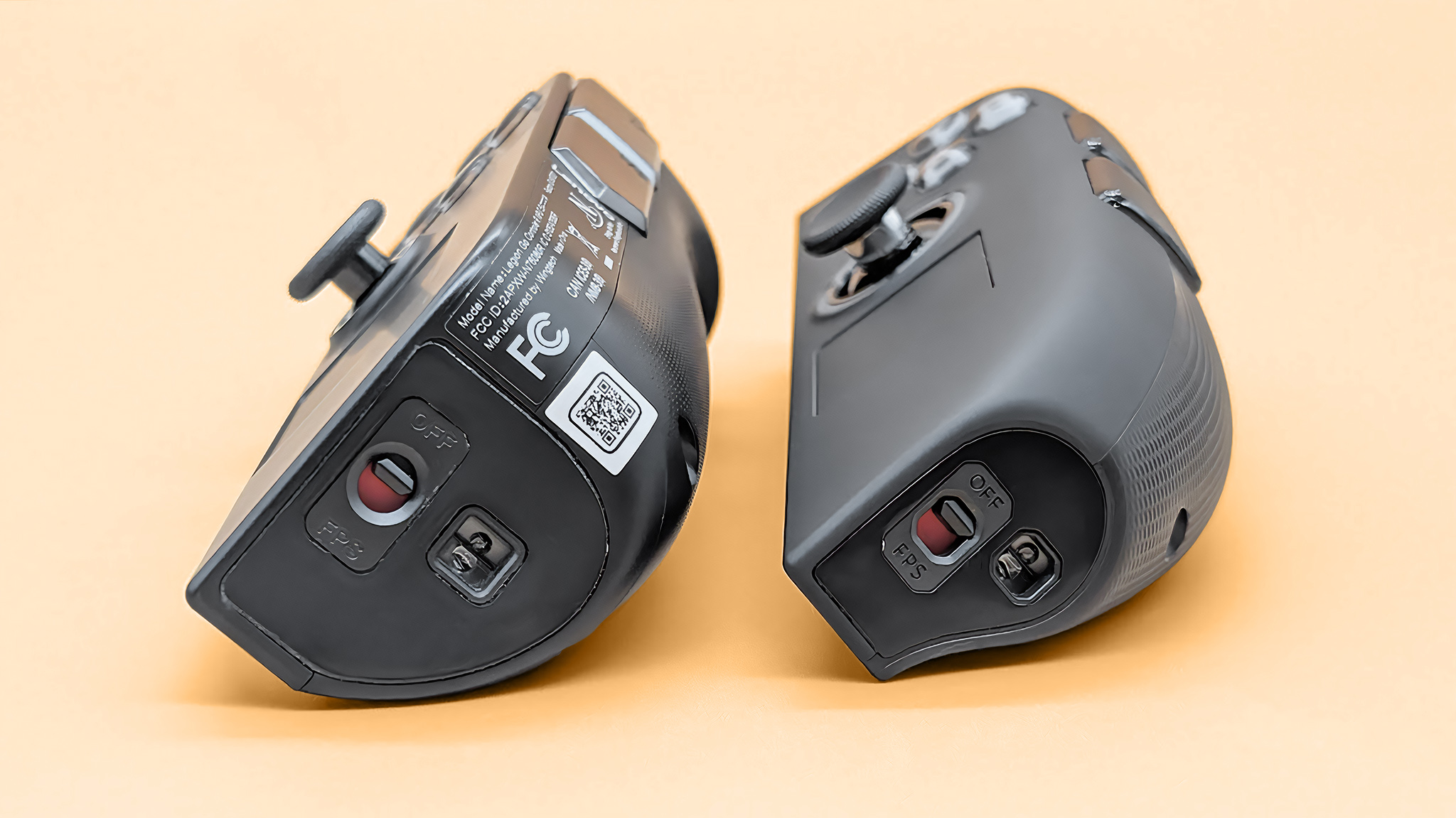 A bottom view of the Lenovo Legion Go 2 and original Legion Go FPS mode switches.