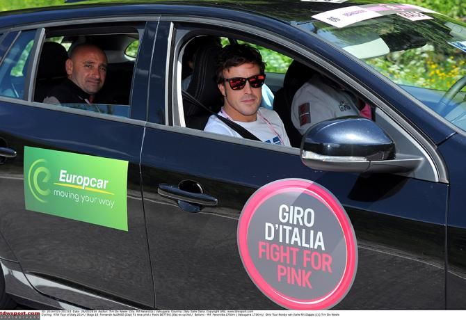 Fernando Alonso watches Stage 18 from the VIP car