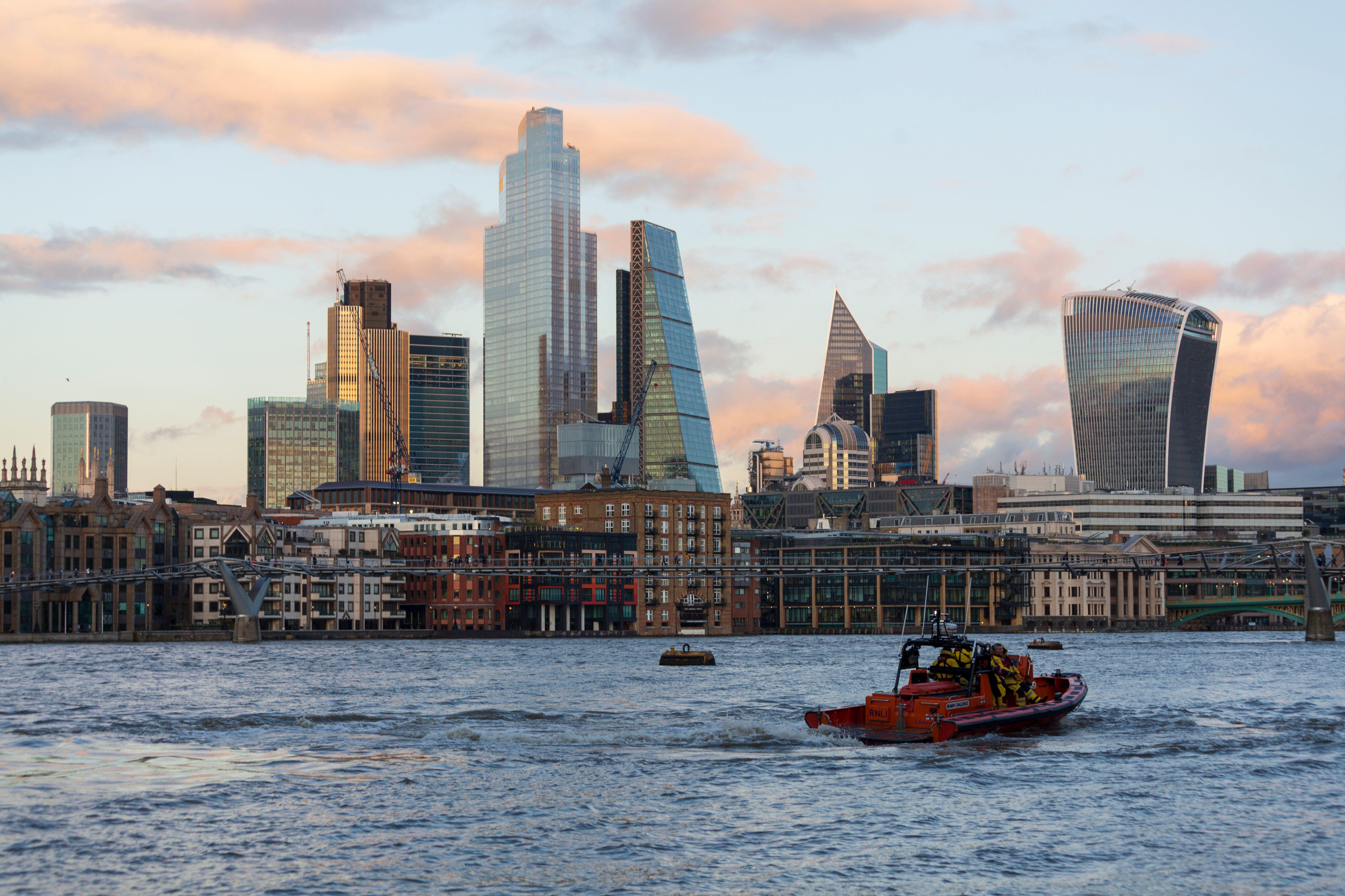 A lifeboat with the skyscrapers of the city of london behind