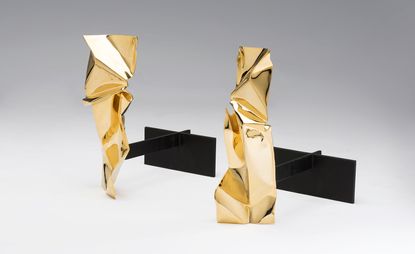  ’Manhattan’ firedogs, a set of gold sculpted ornaments.