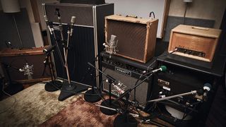 Multiple guitar amps mic'd up in studio
