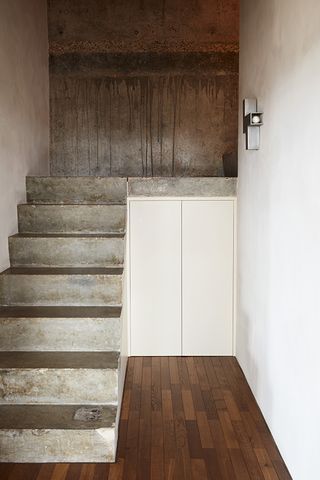 entrance with concrete staircase inside Trellick tower apartment