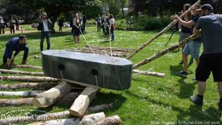 Recently, a group of students from University College London (UCL), in the United Kingdom, staged an archaeology experiment to learn how ancient peoples may have moved the stones of Stonehenge. Here we see a large group of adults using wooden logs and ropes to pull a giant stone.