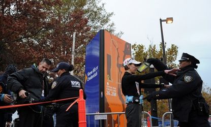 Runners file through a security checkpoint before the start of the ING New York City Marathon on November 3 in Brooklyn.