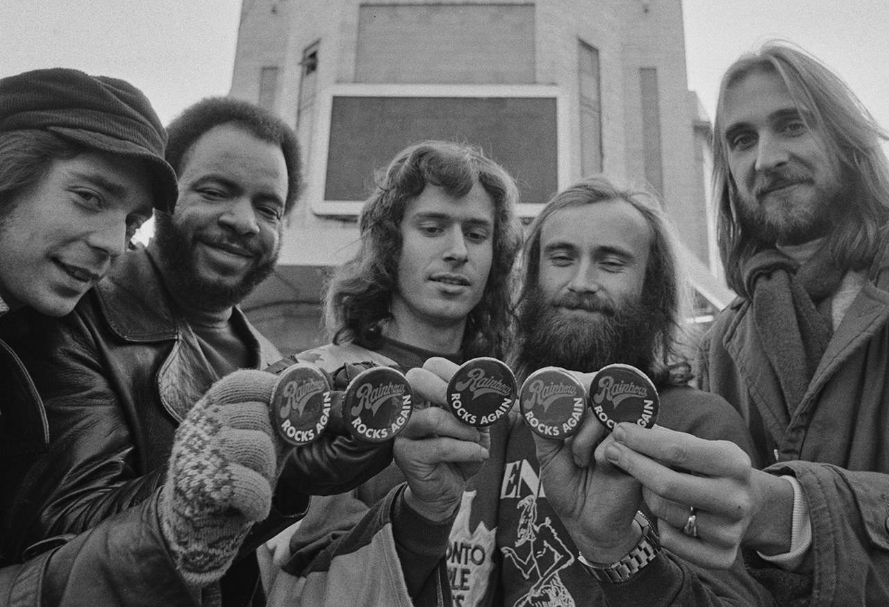 Genesis outside the Rainbow Theatre in London, UK, January 1977. Steve Hackett, Chester Thompson, Tony Banks, Phil Collins, Mike Rutherford. (Photo by Graham Wood/Evening Standard/Hulton Archive/Getty Images)
