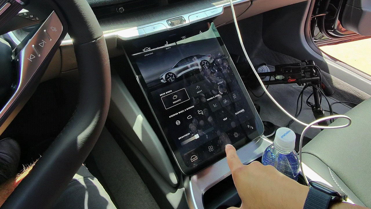 Animation of Lucid Air Pure touchscreen display retracting.