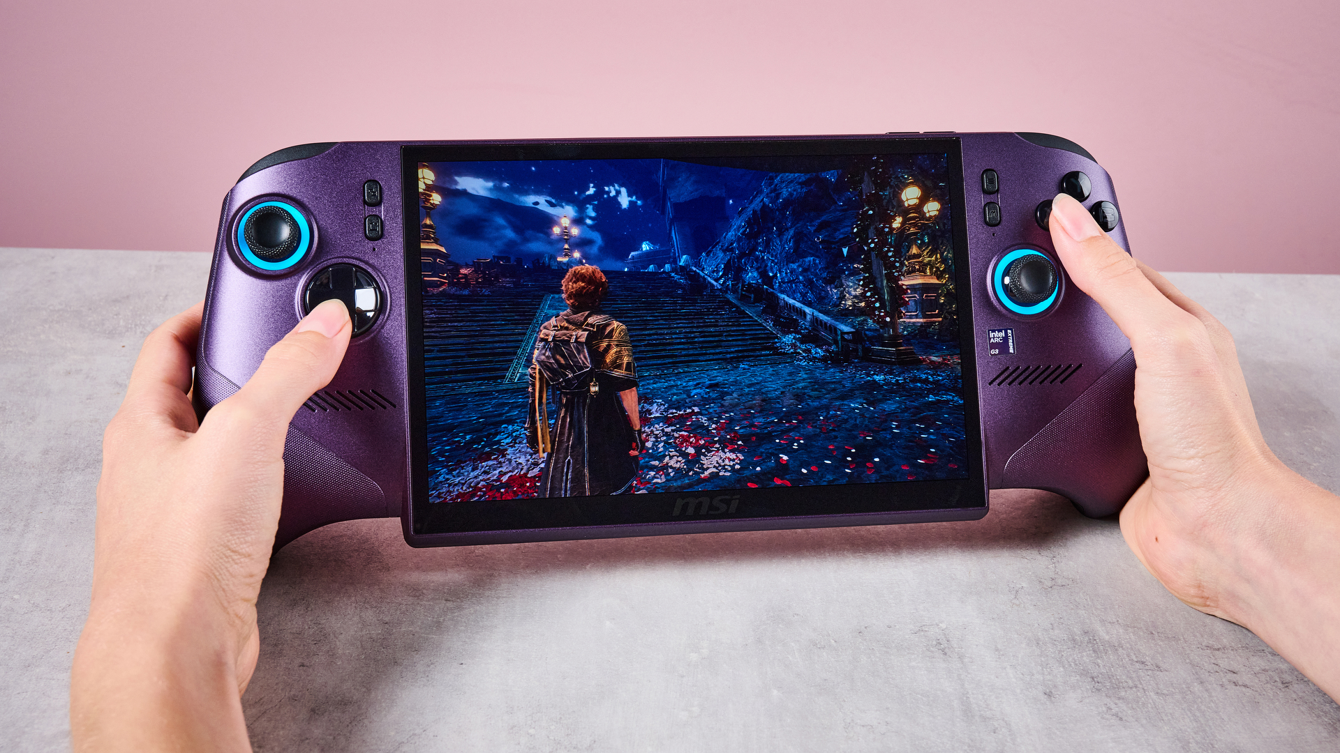 A woman's hands holding the MSI Claw 8 EX AI+ as she plays Clair Obscur: Expedition 33.
