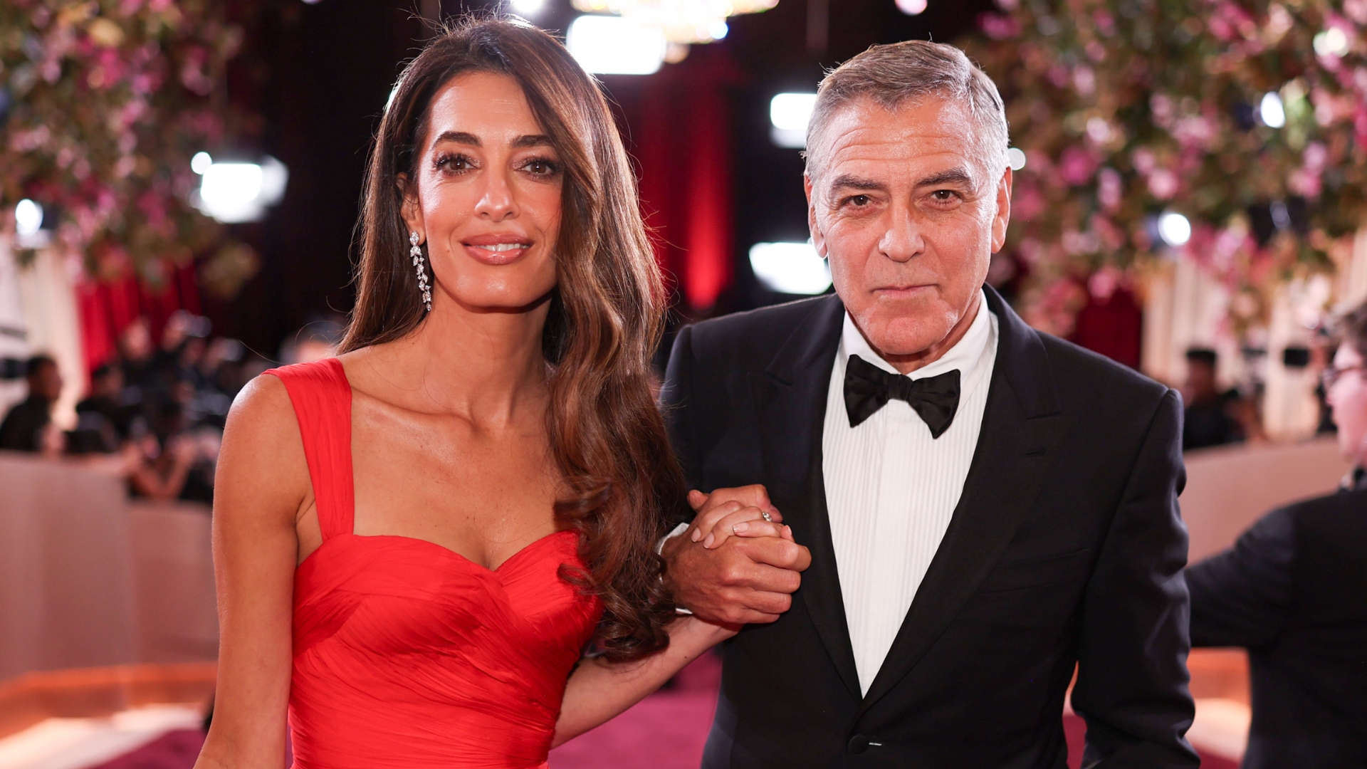 Image of Amal and George Clooney on the Golden Globes 2026 red carpet