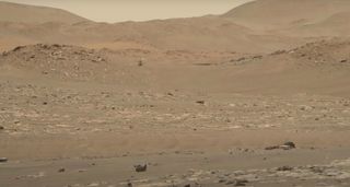 NASA's Ingenuity Mars helicopter conducts its 13th Red Planet flight, on Sept. 4, 2021, in this image captured by NASA’s Perseverance rover. Ingenuity just aced its 21st Mars sortie, NASA officials announced on March 11, 2022. (Photos from the flight were not immediately available.)