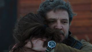 Joel hugging Ellie in the snow in HBO's The Last of Us