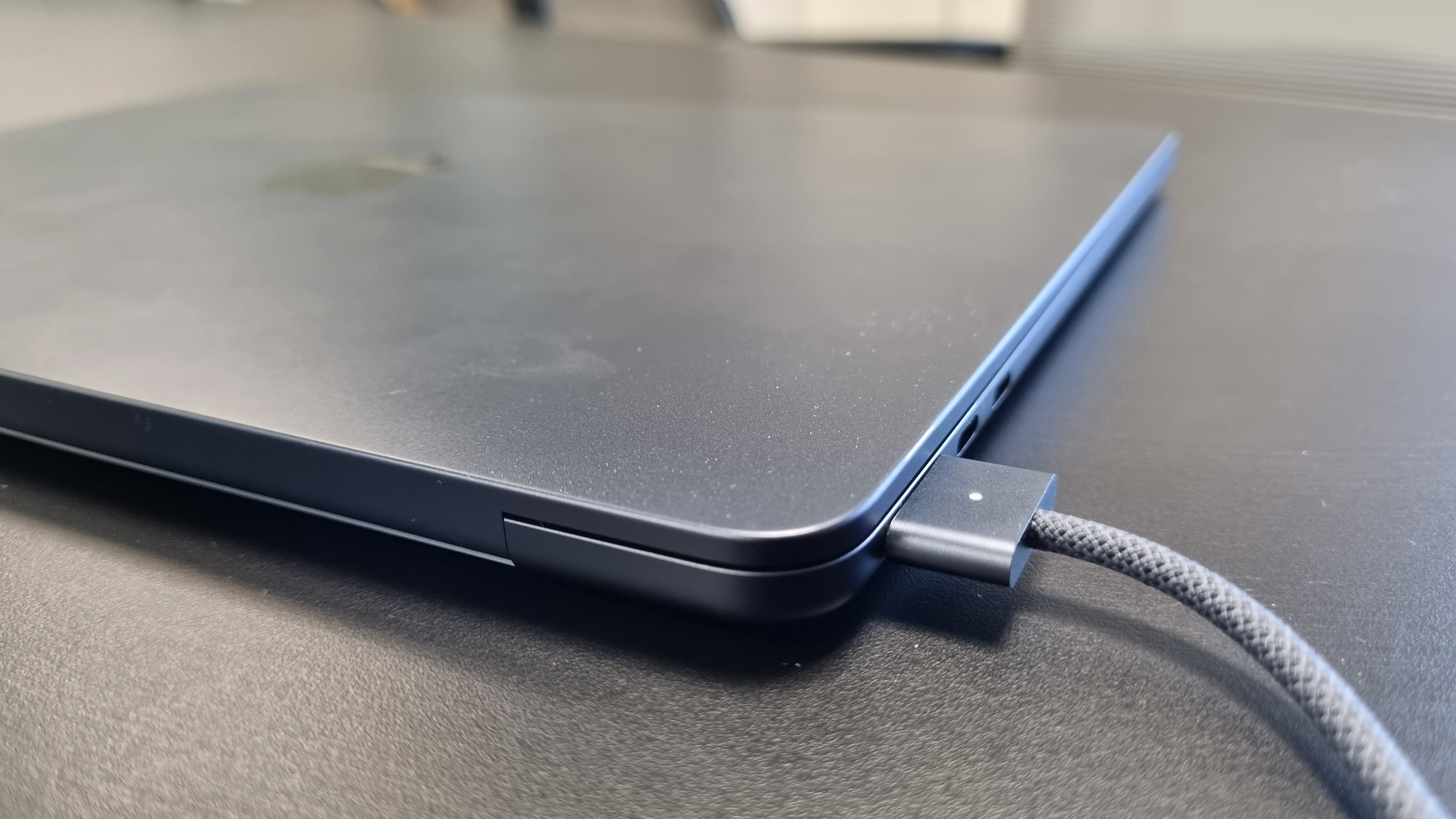 MacBook Air laptop in an office on a black desk