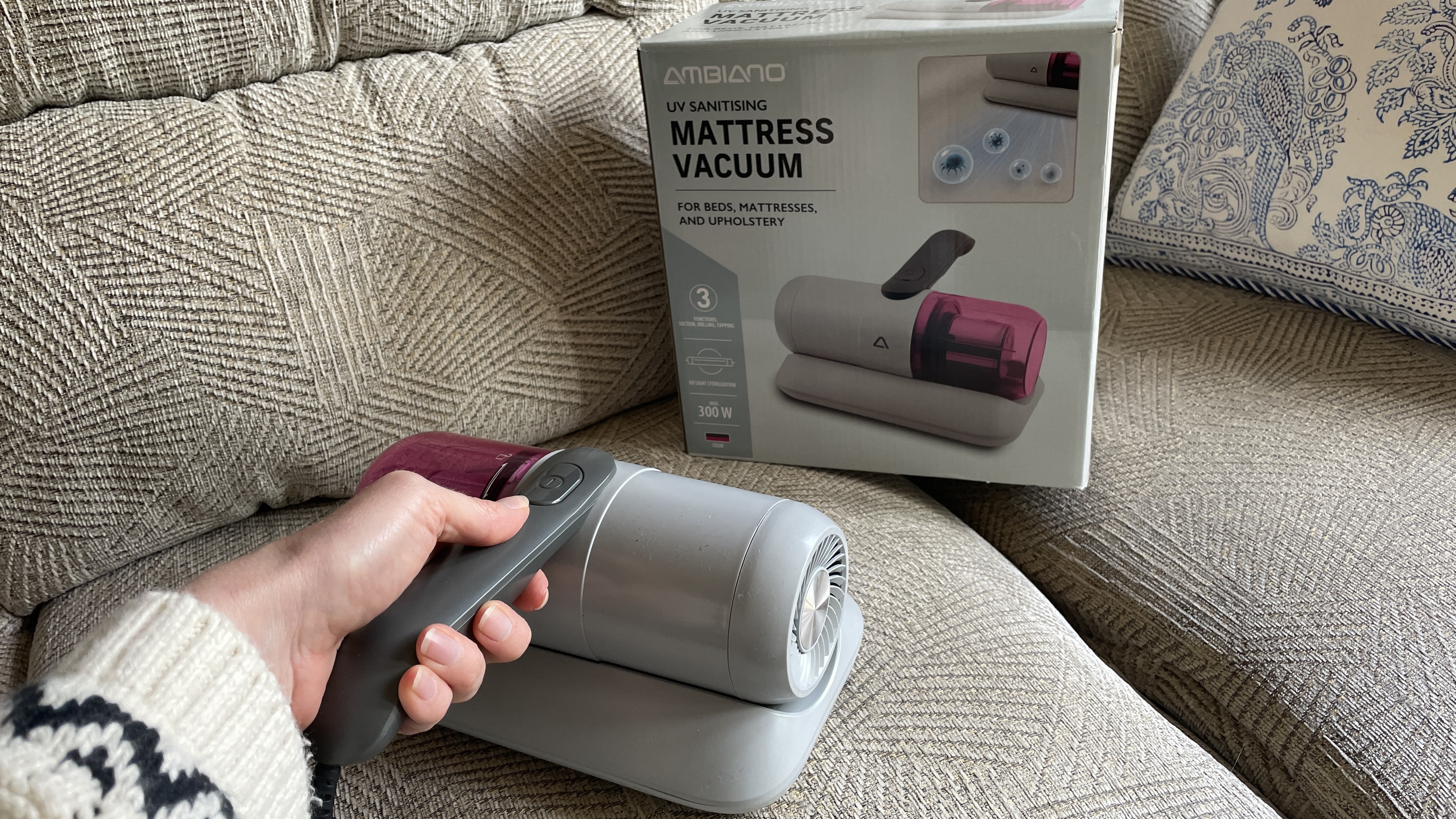 Aldi's Ambiano Mattress Vacuum being used on a mattress and sofa
