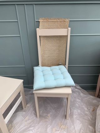 Cane webbing timber chair and blue seat cushion
