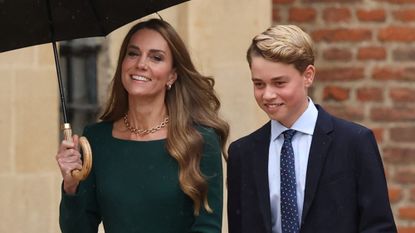Catherine, Princess of Wales holds an umbrella and walks with Prince George as he arrives for his first day at Eton College on September 8, 2026