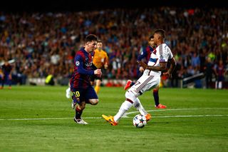 Lionel Messi of Barcelona passes by Jerome Boateng of Bayern to score his second goal during the first leg of UEFA Champions League semifinal match between FC Barcelona and FC Bayern Muenchen at Camp Nou on May 6, 2015 in Barcelona, Spain.