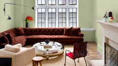 red sofa and coffee table in green living room
