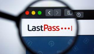 The LastPass logo in a stylized web browser under a magnifying glass.