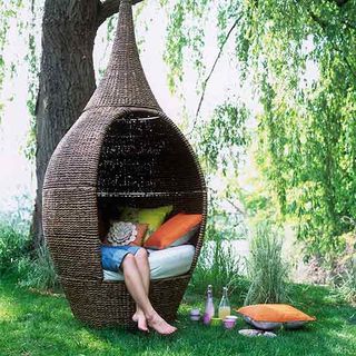 weaver bird swing with women green plant cushion