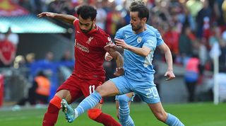 Mohamed Salah and Bernardo Silva in action in an FA Cup semi-final between Liverpool and Manchester City in April 2022.