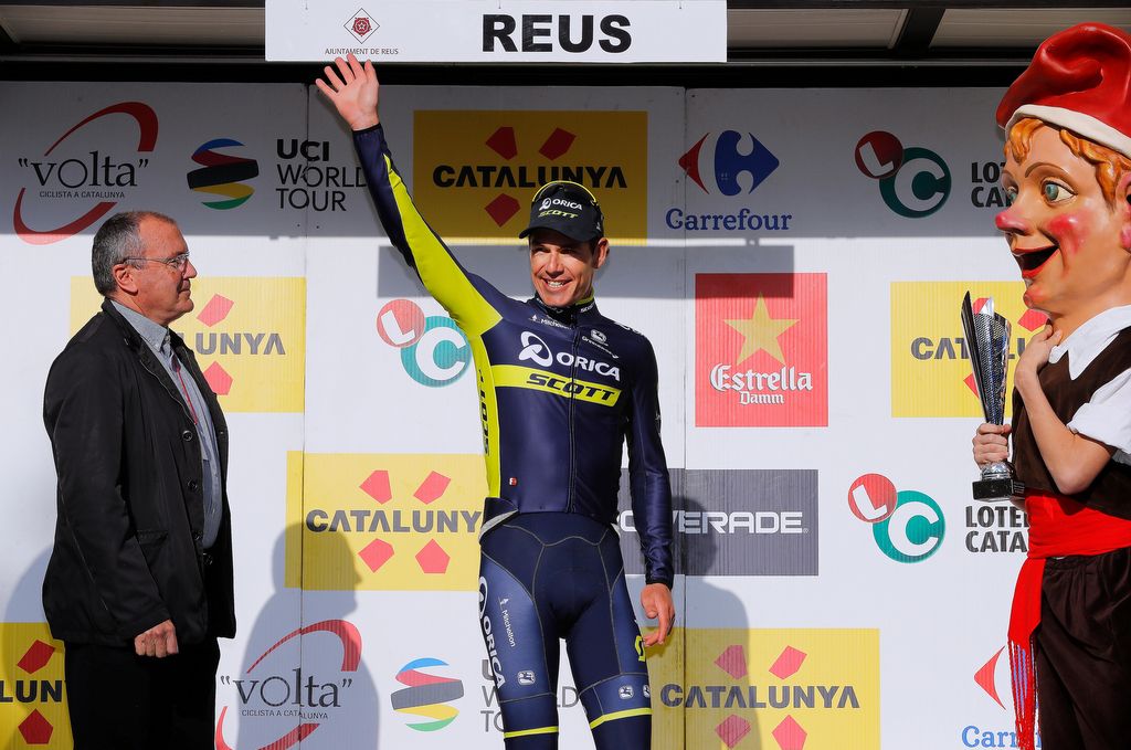 Daryl Impey (Orica-Scott) waves from the podium