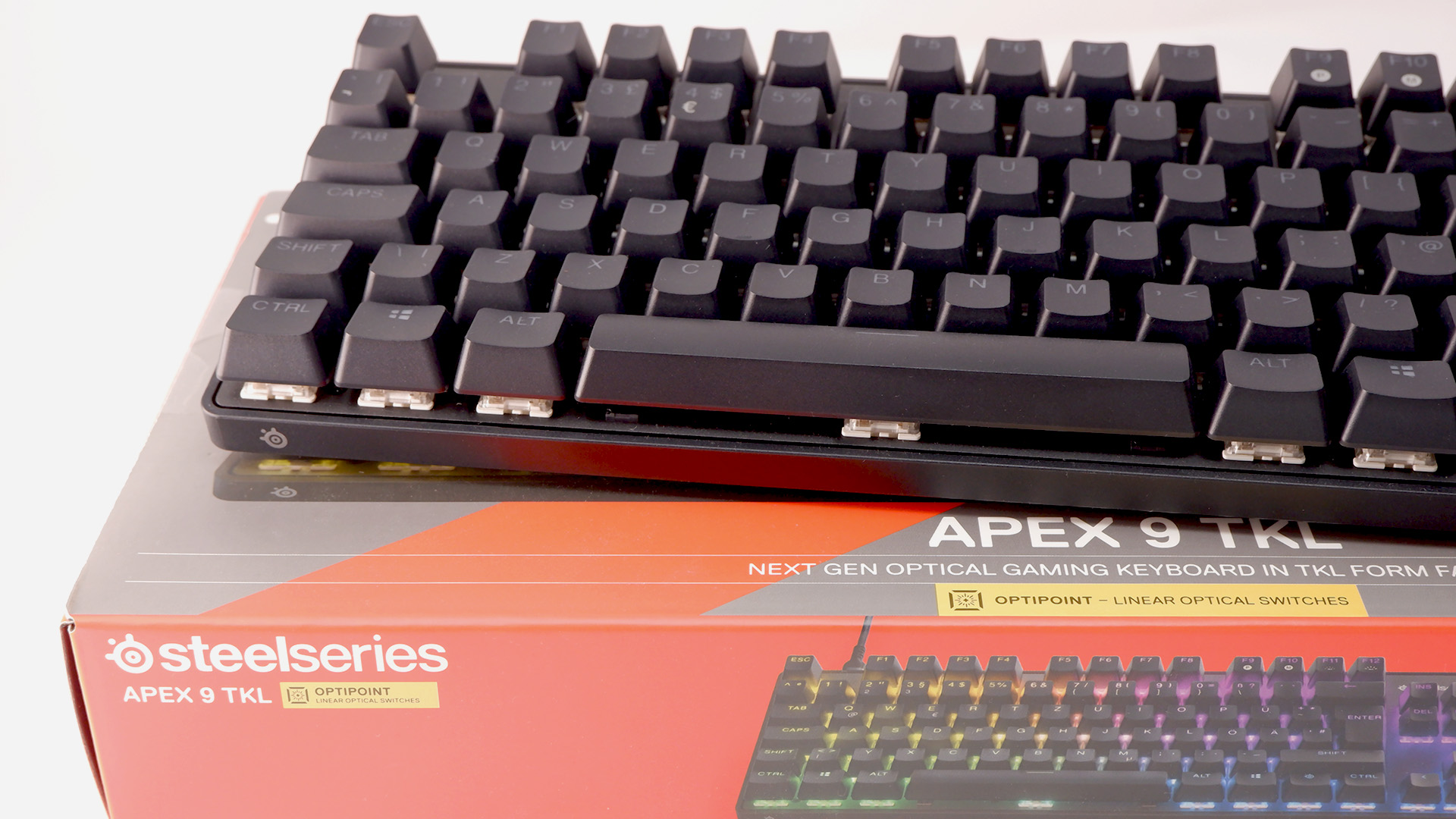 SteelSeries Apex 9 TKL gaming keyboard pictured on its box.