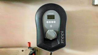 zappi electric car charger on garage wall