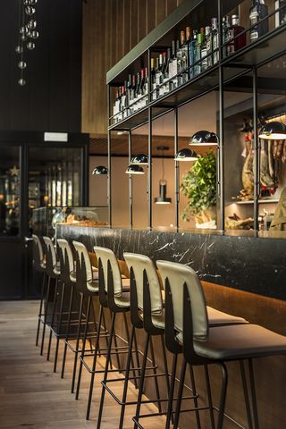 Bar view with high backed stools