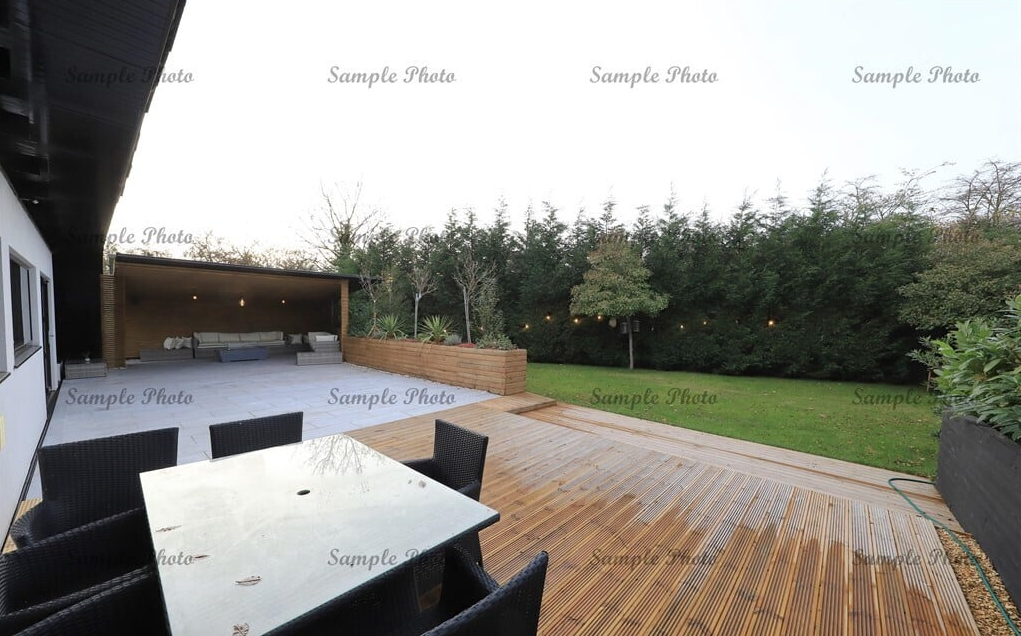 A back garden with extension and sitting area