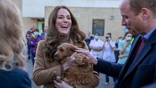 Kate Middleton holding a dog