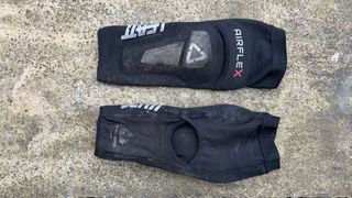 Leatt Airflex Hybrid Pro Knee Guard laid out on the ground