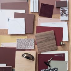 cork board covered in swatches of paint and fabric and wood samples