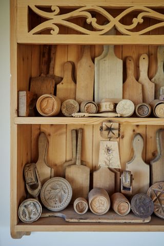 wooden antiques on a shelving unit