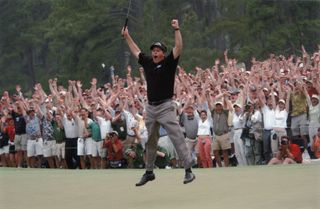 Phil Mickelson celebrates holing a putt to win the 2004 Masters