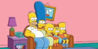 The Simpsons family sitting on the couch