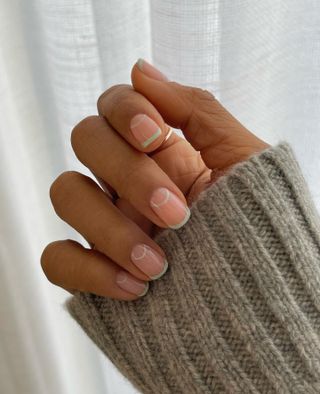 a matcha green French tip manicure