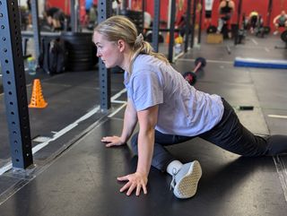 Physiotherapist Stephanie Clark demonstrates pigeon pose