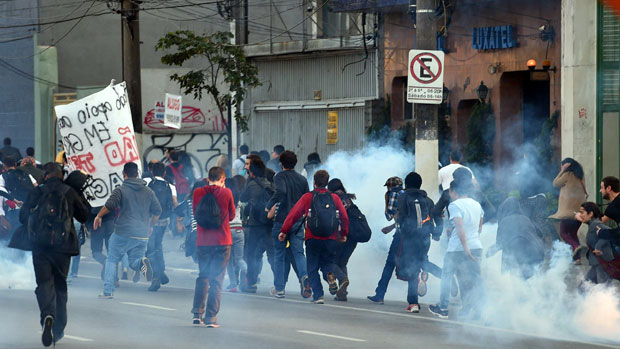 Subway workers on strike are dispersed with tear gas by police in Sao Paulo