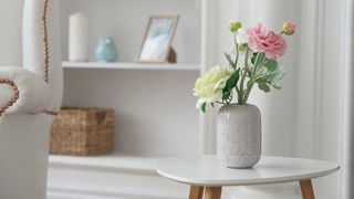 Small ceramic vase of flowers on a side table