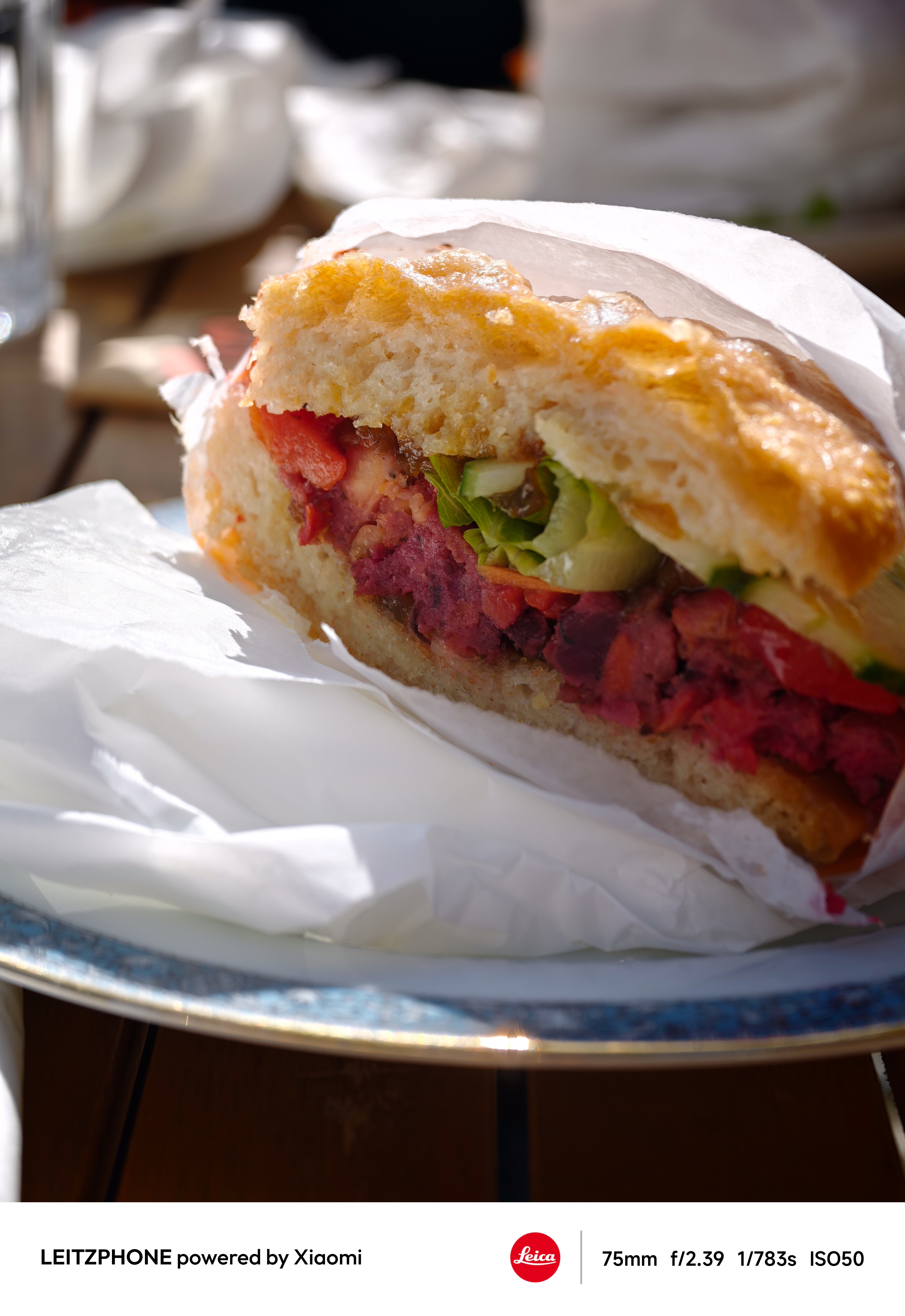 Close-up of a sandwich with salad and red filling