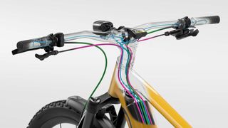 A diagram with an inside look at the internal cable routing through the handlebars and stem