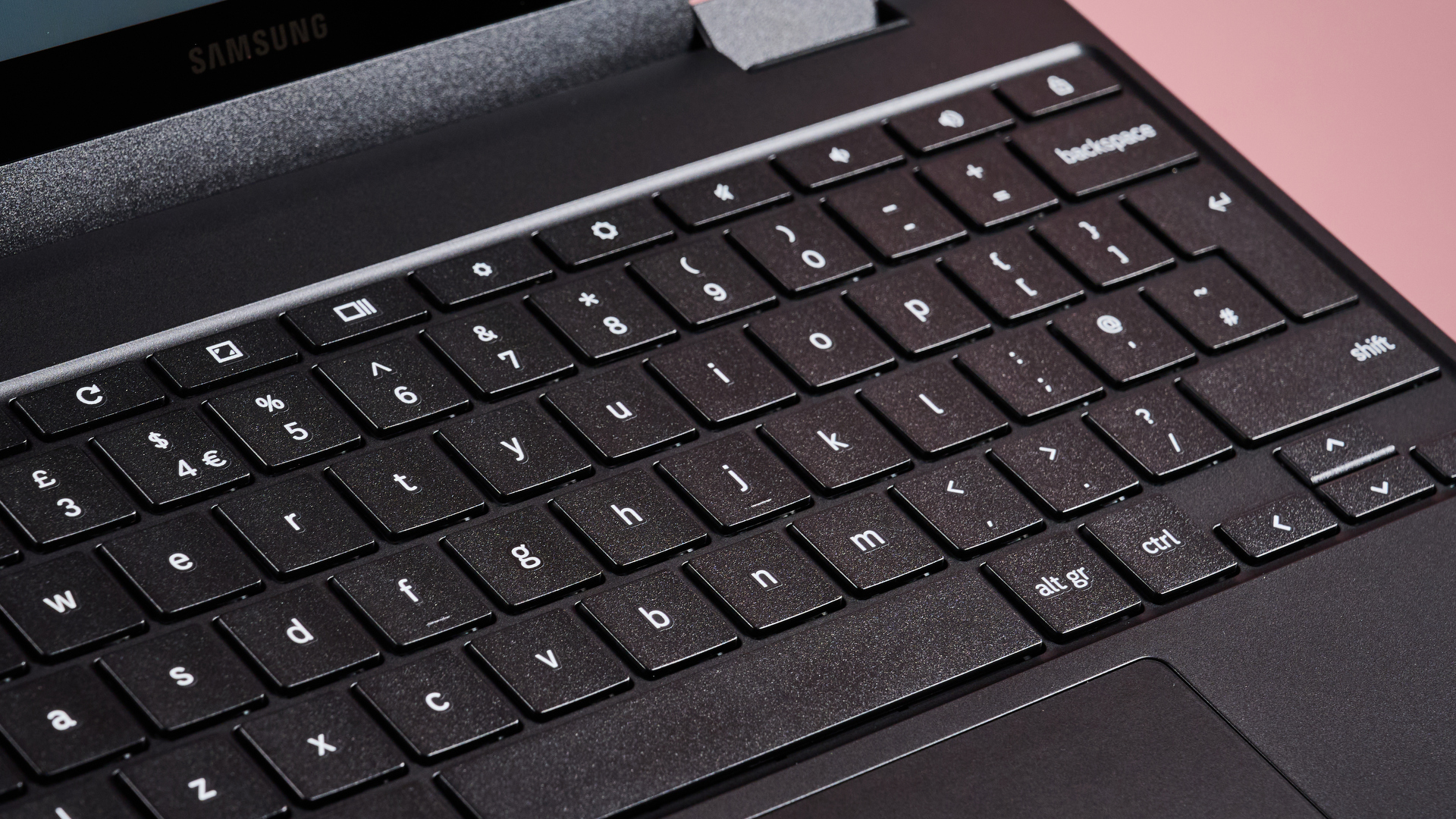 Close-up of keyboard on Samsung Galaxy Chromebook 2 360, open with pink background
