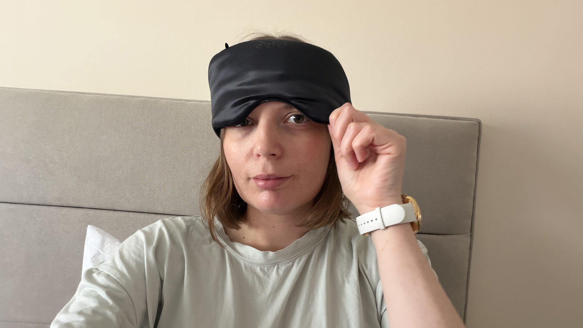 An image of our tester, Ruth Jones, adjusting the SilkSound Sleep mask